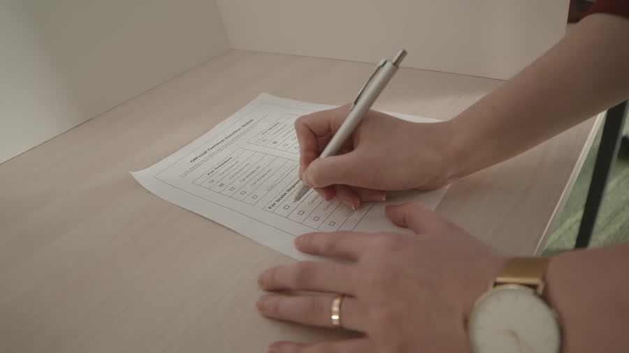 A voter marking a paper ballot